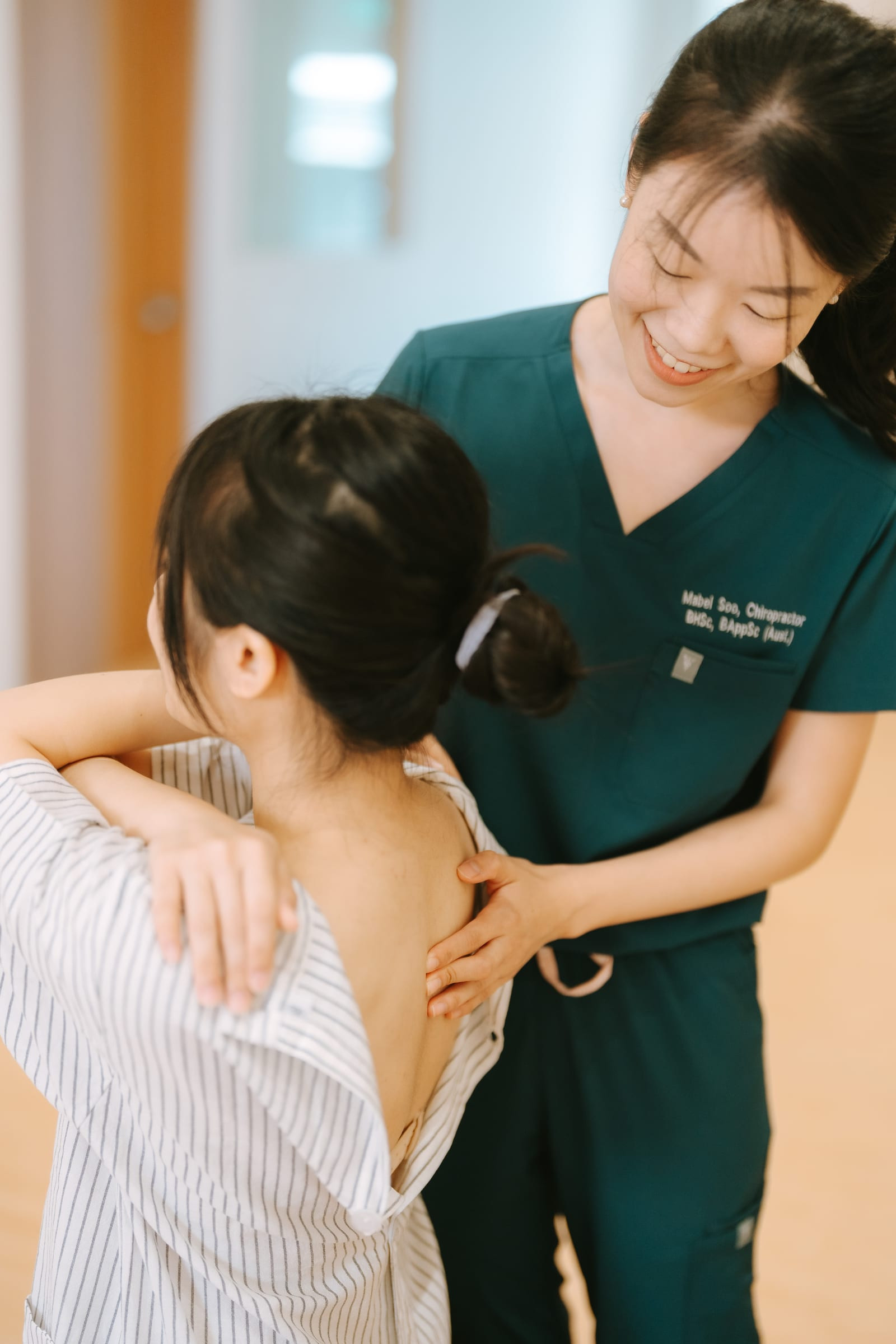 Mabel Soo performing spinal movement and posture evaluation