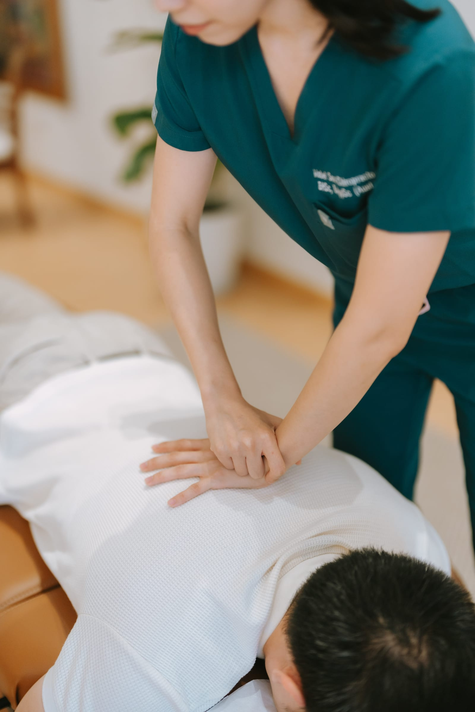 Chiropractic adjustment session for upper back tension relief